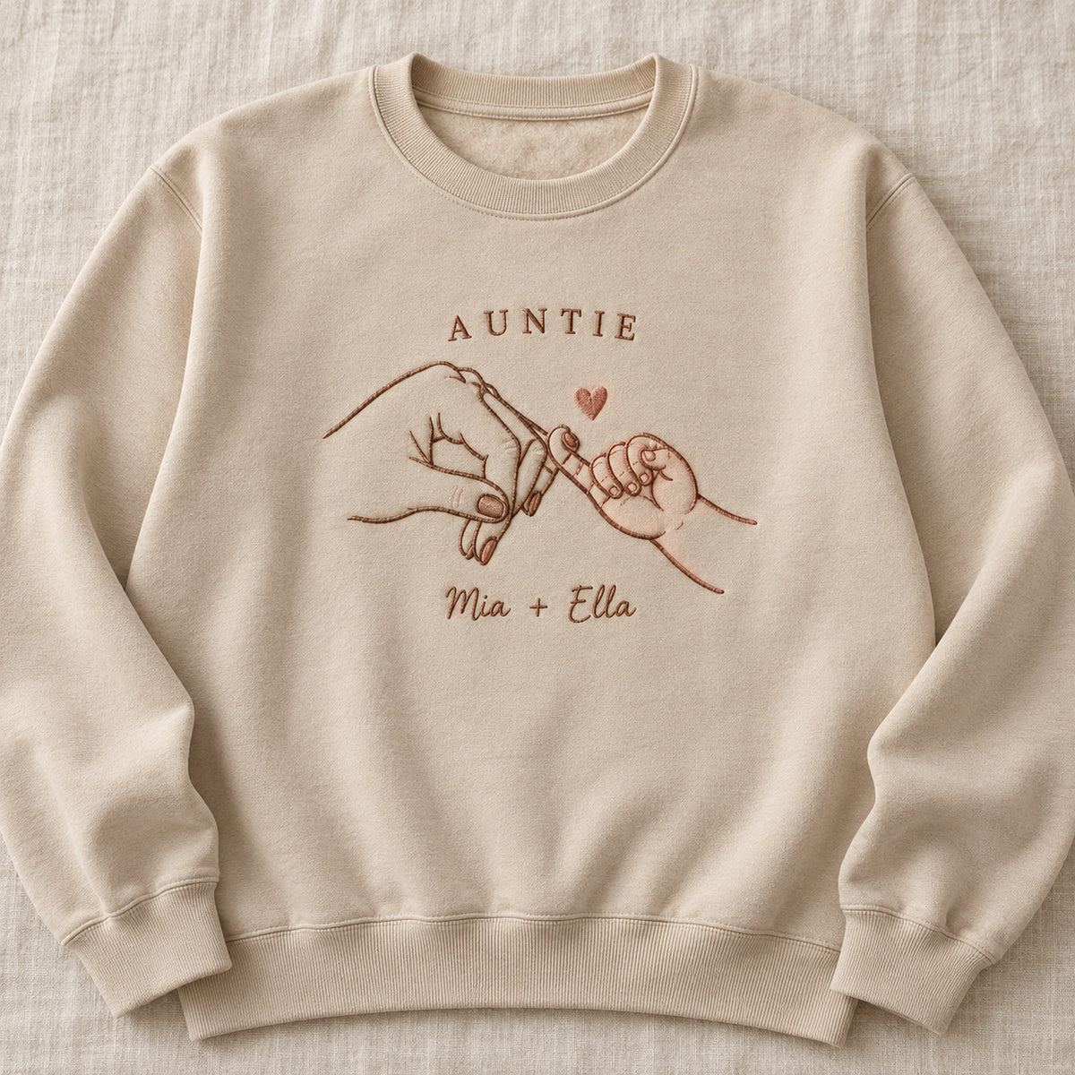 Pinky Adventure personalized Auntie hands design; Sand sweatshirt mockup, hero; sample text AUNTIE / Mia + Ella