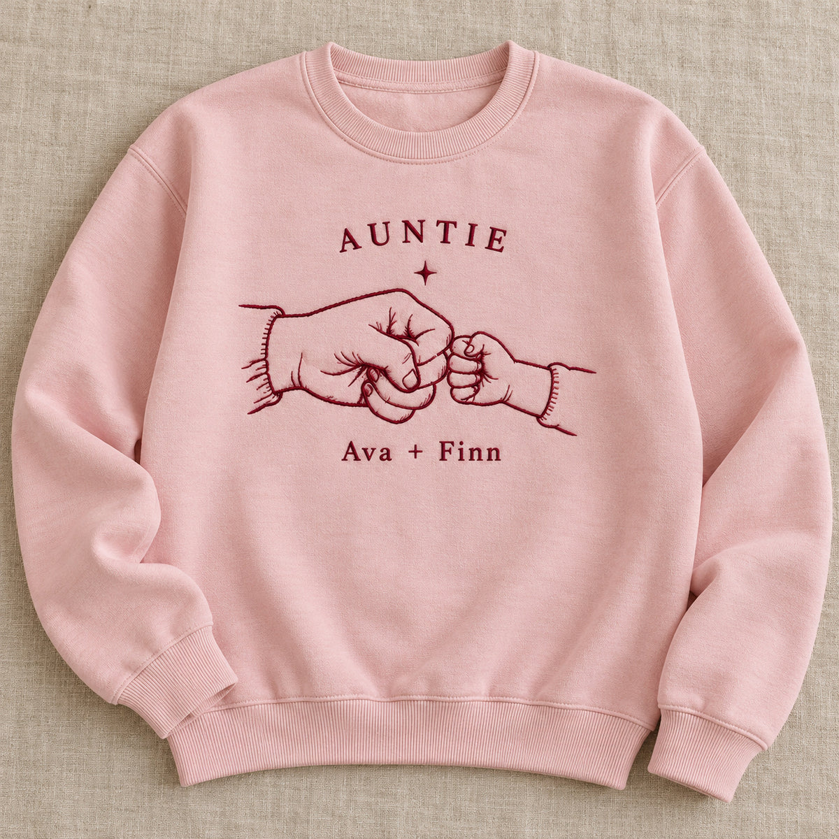First Fist Bump personalized Auntie hands design; Light Pink sweatshirt mockup, hero; sample text AUNTIE / Ava + Finn