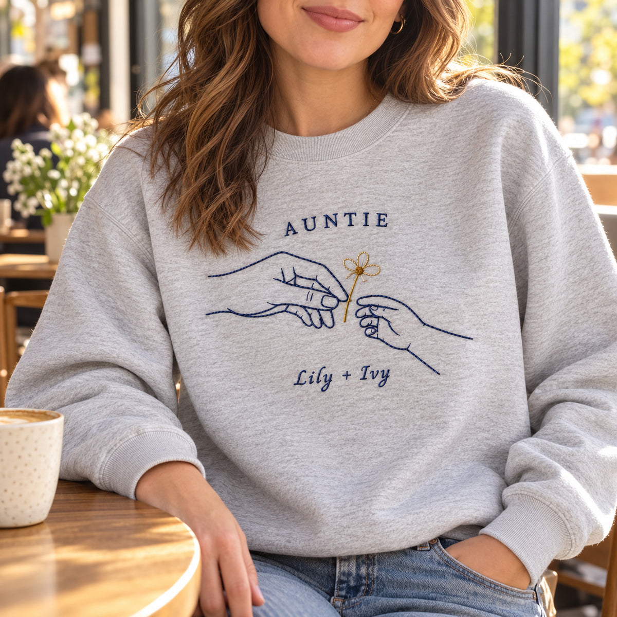 Gift of Daisies personalized Auntie hands design; Ash sweatshirt mockup, lifestyle; sample text AUNTIE / Lily + Ivy