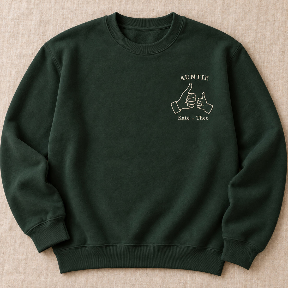 Thumbs Up Team personalized Auntie hands design; Forest Green sweatshirt mockup, hero; sample text AUNTIE / Kate + Theo