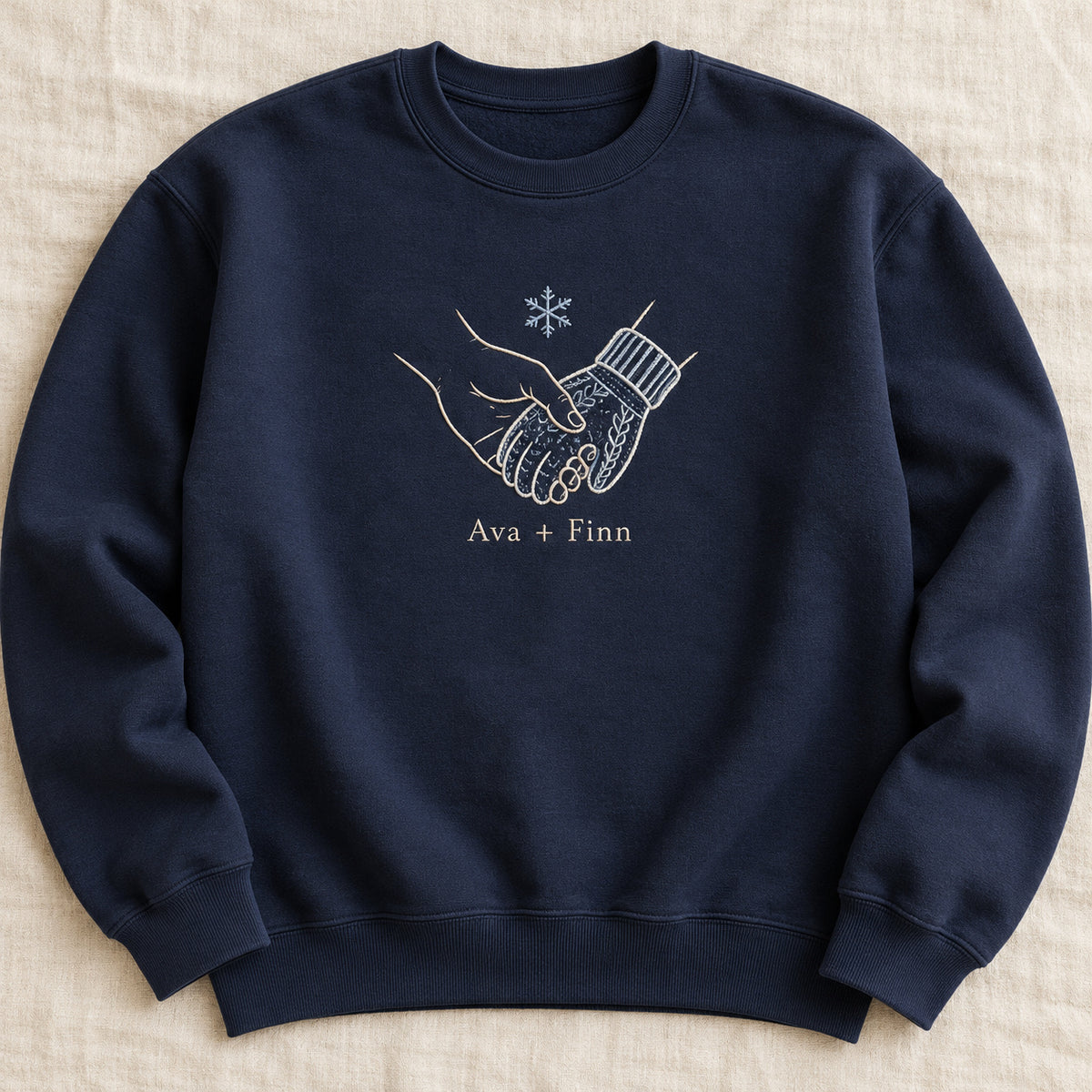 Warm Winter Hold personalized Christmas hands design; Navy sweatshirt mockup, hero; sample text Ava + Finn
