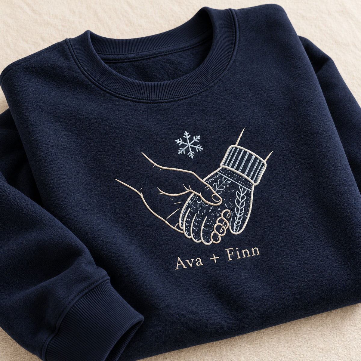 Warm Winter Hold personalized Christmas hands design; Navy sweatshirt mockup, personalization detail; sample text Ava + Finn