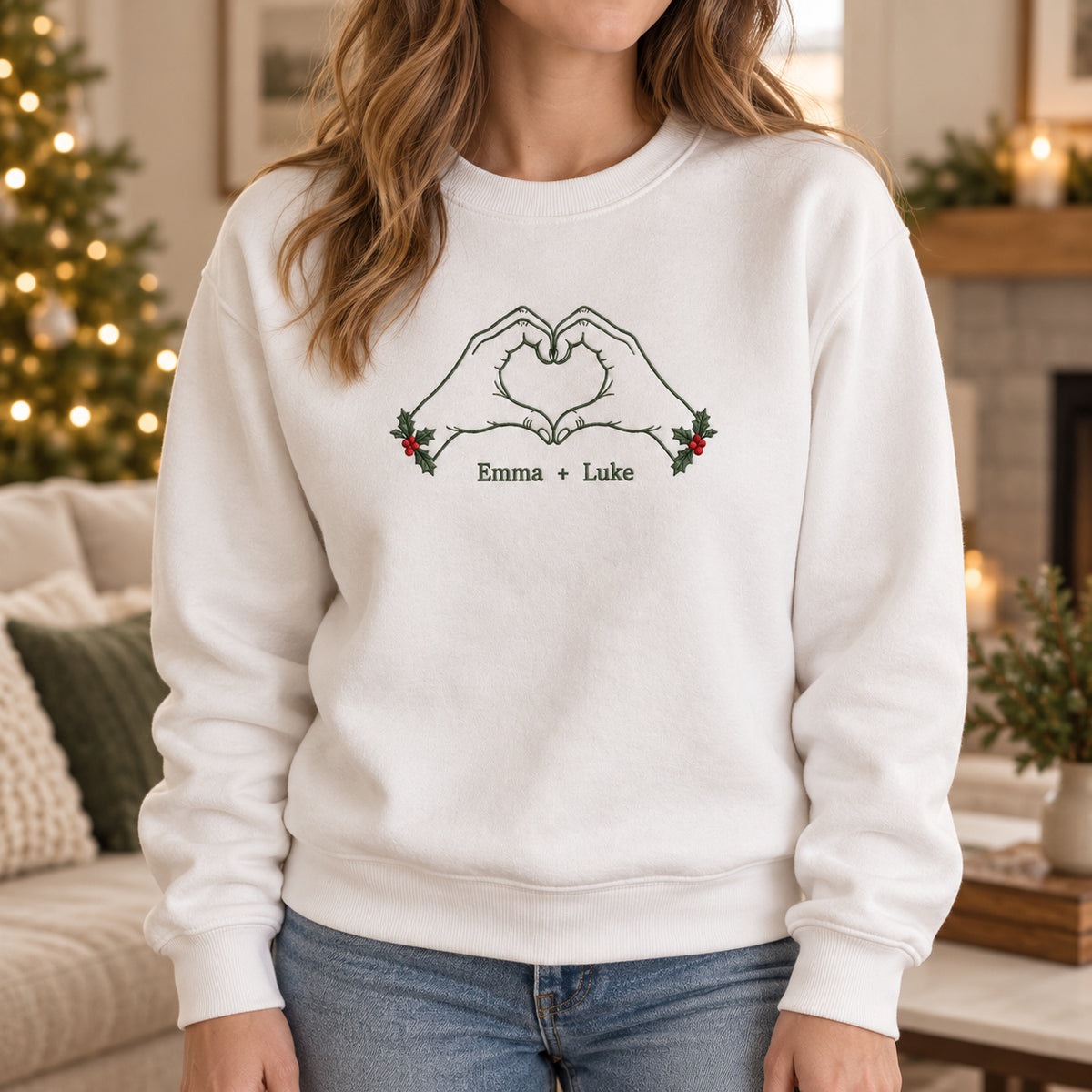 Christmas Heart Hands personalized Christmas hands design; White sweatshirt mockup, lifestyle; sample text Emma + Luke
