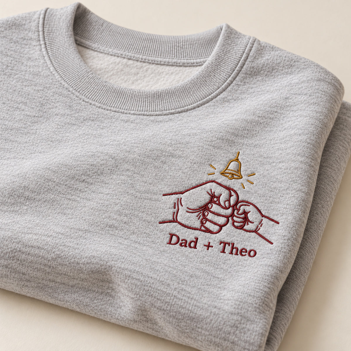 Tiny Bell Promise personalized Christmas hands design; Ash sweatshirt mockup, personalization detail; sample text Dad + Theo