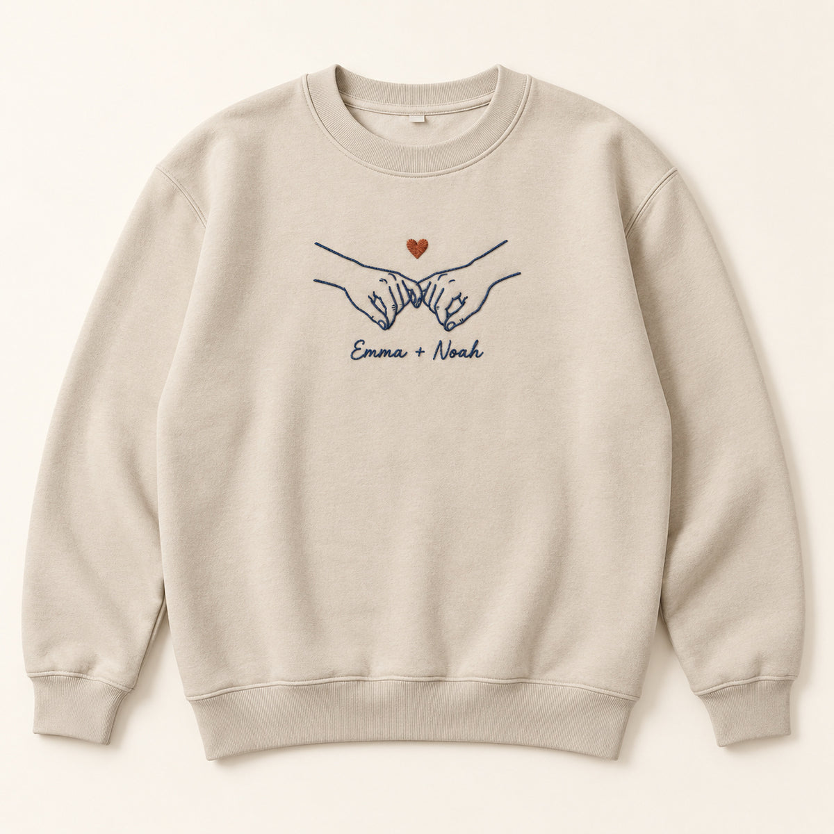Pinky Promise personalized Couples hands design; Sand sweatshirt mockup, hero; sample text Emma + Noah