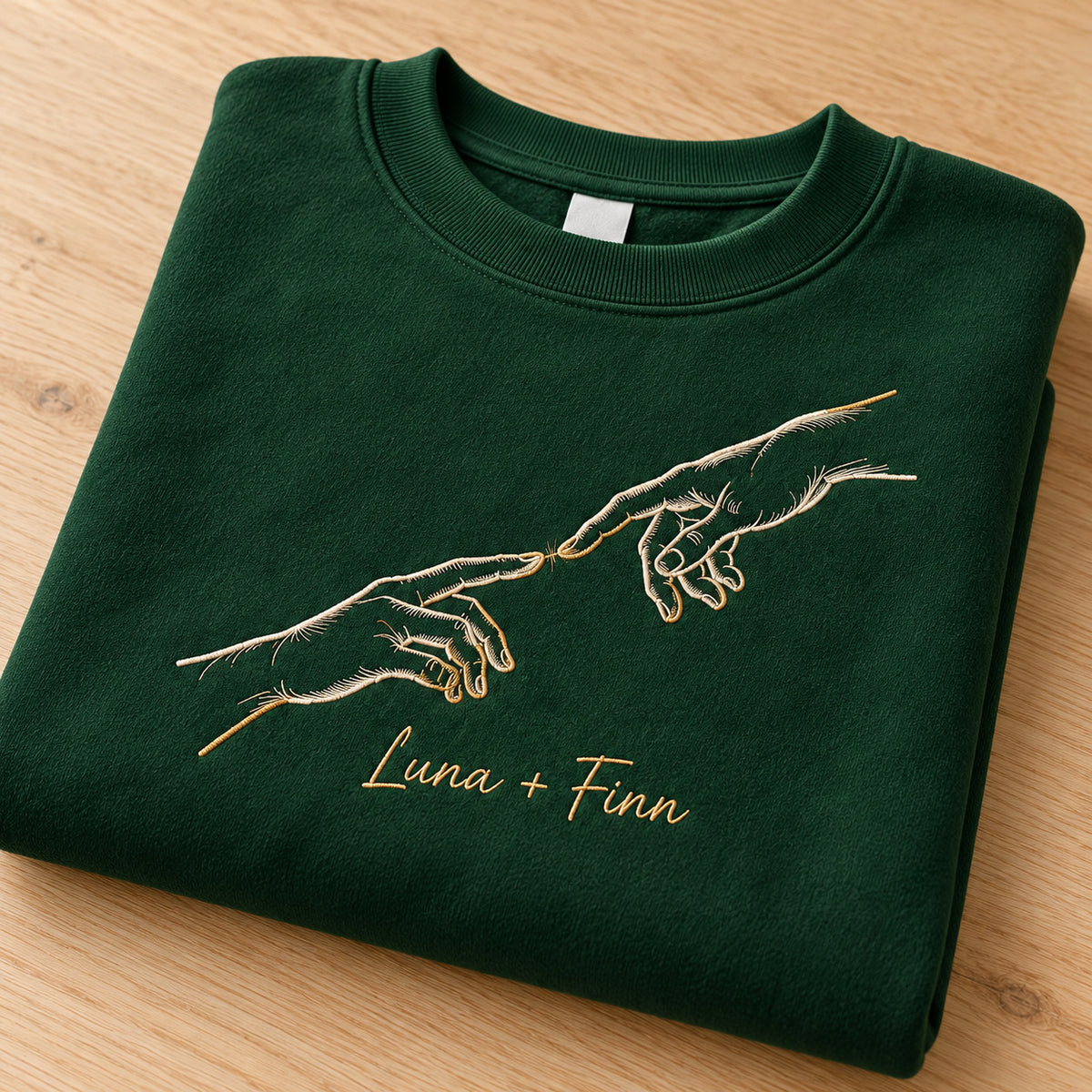 Forever Touch personalized Couples hands design; Forest Green sweatshirt mockup, personalization detail; sample text Luna + Finn