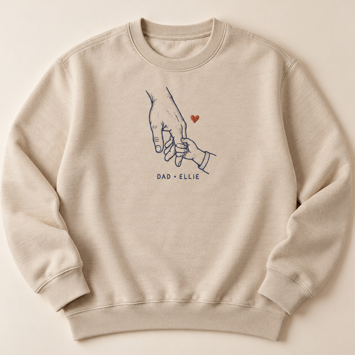 Little Grip personalized Dad hands design; Sand sweatshirt mockup, hero; sample text DAD • ELLIE