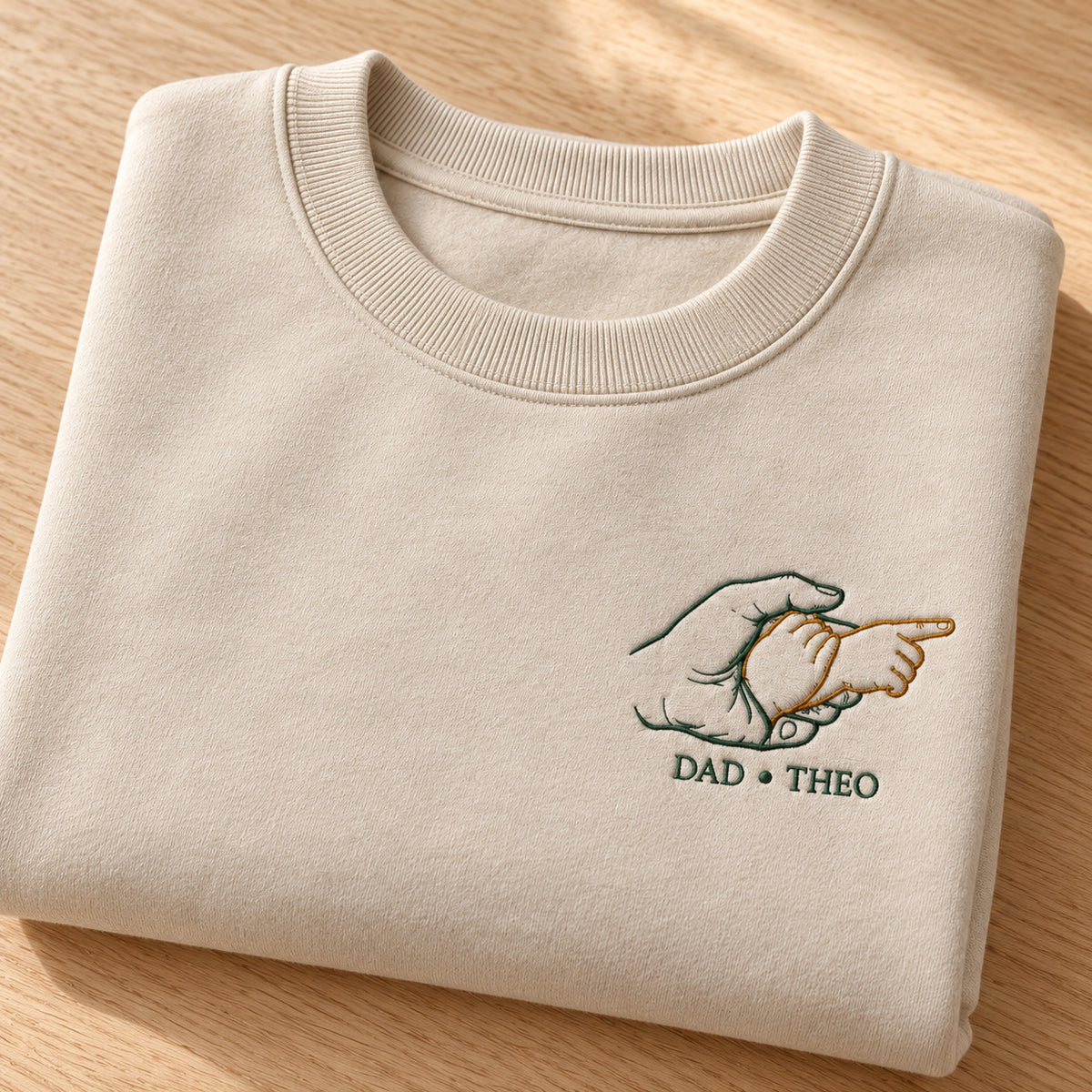 Guiding The Way personalized Dad hands design; Beige sweatshirt mockup, personalization detail; sample text DAD • THEO