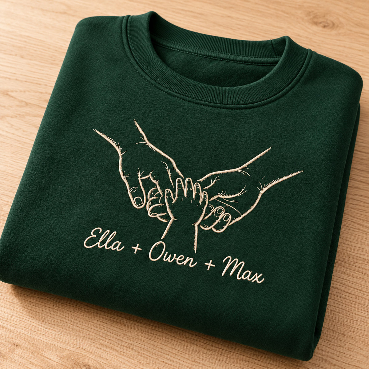 Together Always personalized Family hands design; Forest Green sweatshirt mockup, personalization detail; sample text Ella + Owen + Max