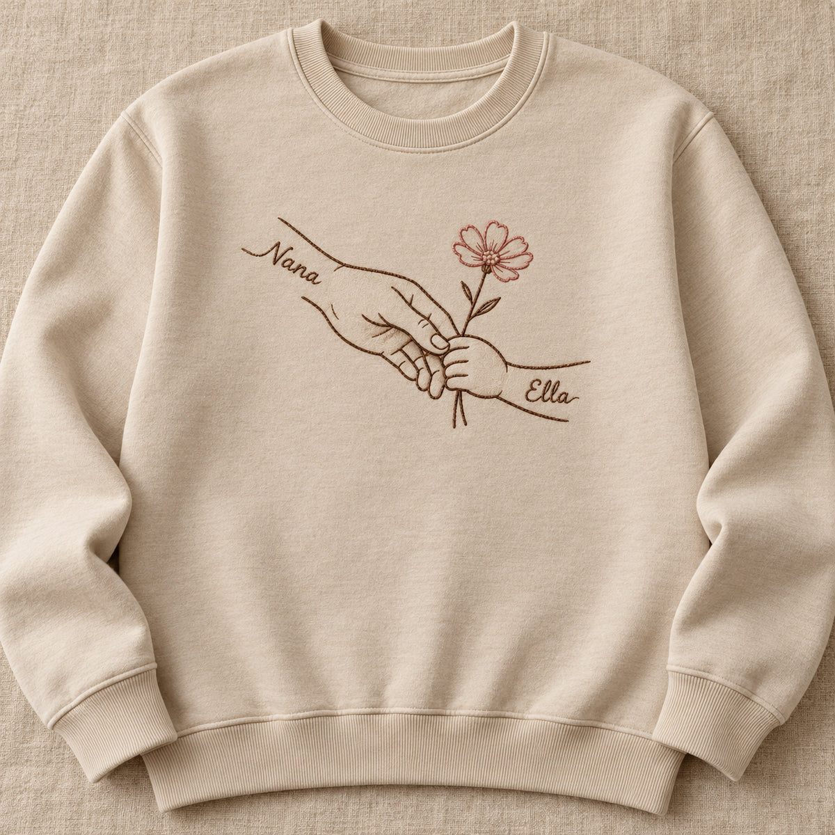 Teaching Gentle Hands personalized Grandma hands design; Beige sweatshirt mockup, hero; sample text Nana / Ella