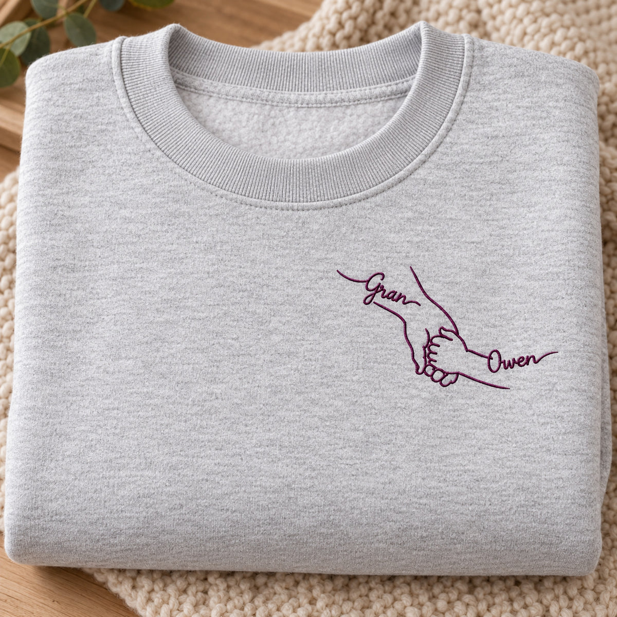 Little Hand Big Love personalized Grandma hands design; Ash sweatshirt mockup, personalization detail; sample text Gran / Owen