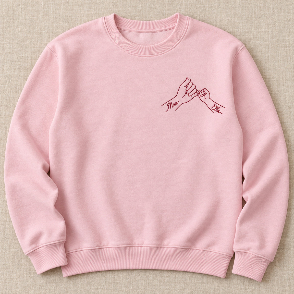 Pinky Promise personalized Mom hands design; Light Pink sweatshirt mockup, hero; sample text Mom / Ella