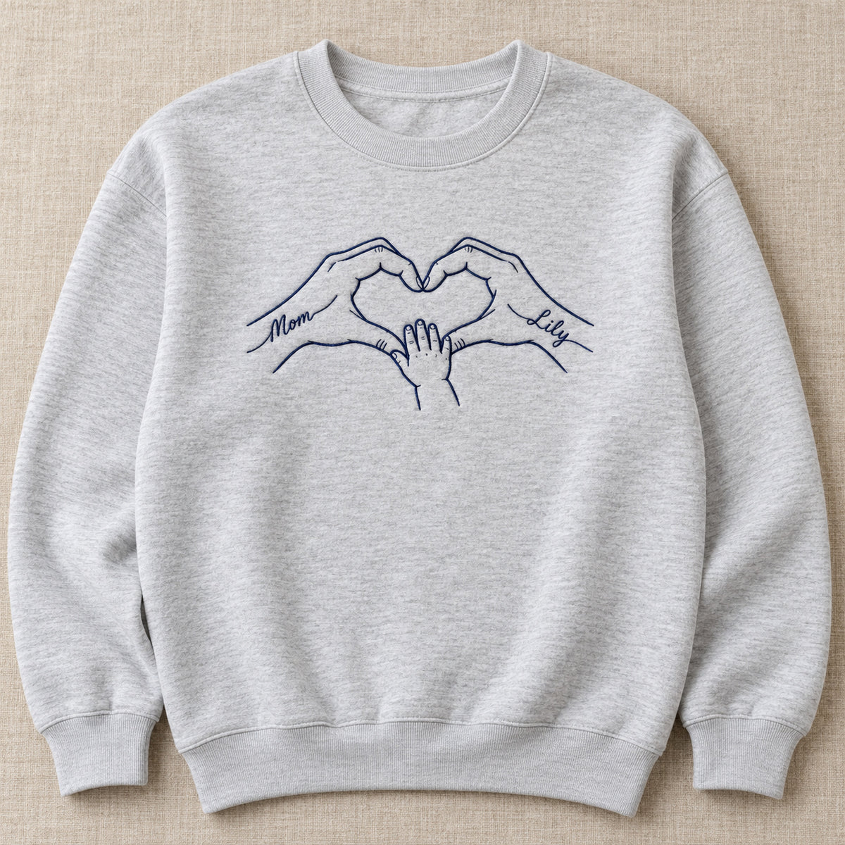 Heart Together personalized Mom hands design; Ash sweatshirt mockup, hero; sample text Mom / Lily