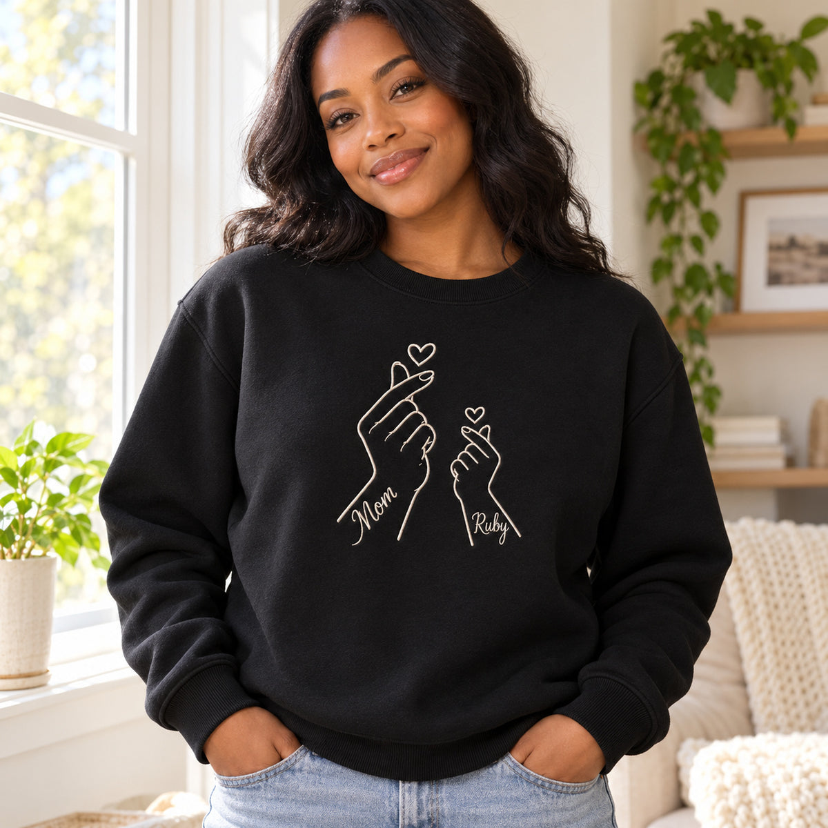 Love Sign personalized Mom hands design; Black sweatshirt mockup, lifestyle; sample text Mom / Ruby