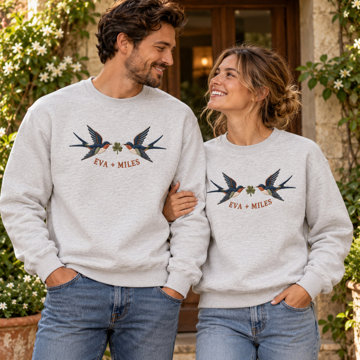 Returning Swallows sweatshirt concept mockup featuring two returning swallows with a leafy sprig, sample personalization EVA + MILES, lifestyle view