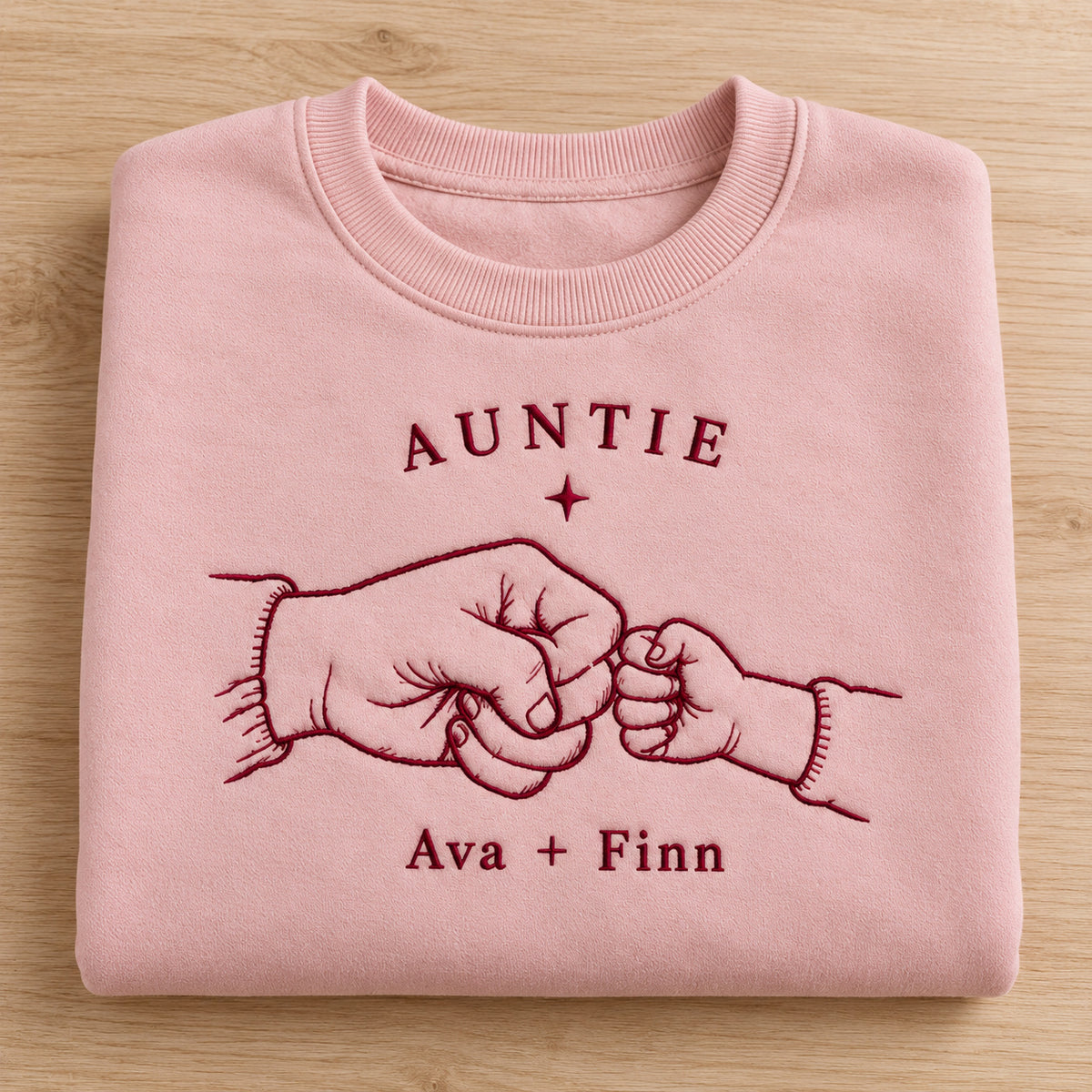 First Fist Bump personalized Auntie hands design; Light Pink sweatshirt mockup, personalization detail; sample text AUNTIE / Ava + Finn