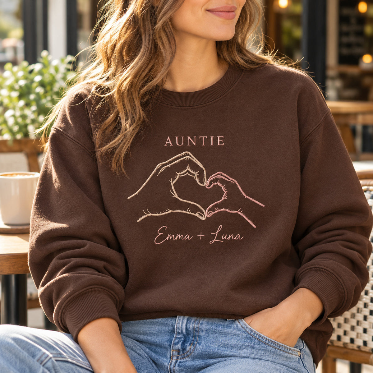Tiny Hand Heart personalized Auntie hands design; Chocolate sweatshirt mockup, lifestyle; sample text AUNTIE / Emma + Luna
