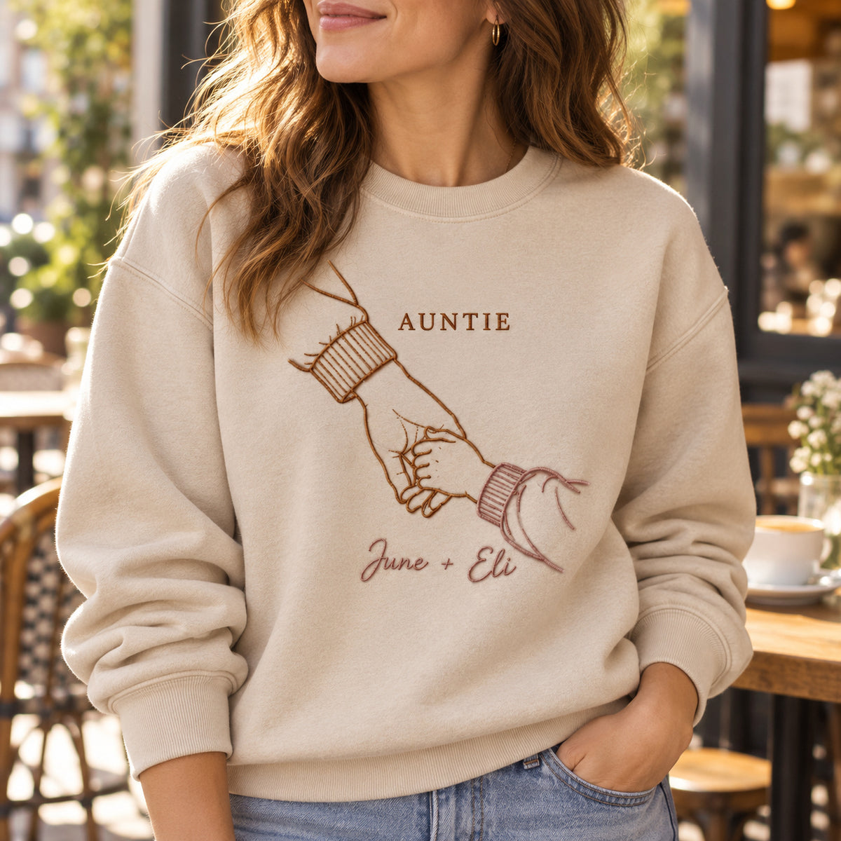 Walking Together personalized Auntie hands design; Beige sweatshirt mockup, lifestyle; sample text AUNTIE / June + Eli