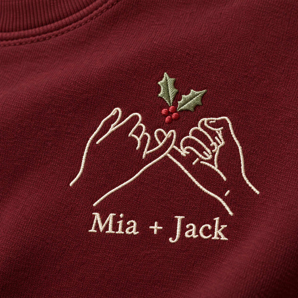 Holiday Pinky Promise personalized Christmas hands design; Maroon sweatshirt mockup, embroidery detail; sample text Mia + Jack