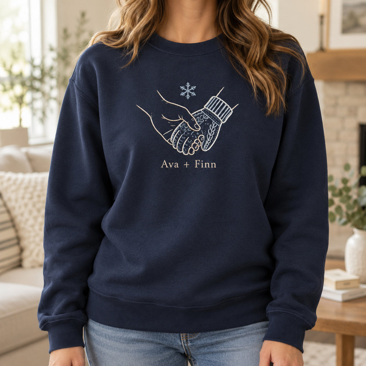 Warm Winter Hold personalized Christmas hands design; Navy sweatshirt mockup, lifestyle; sample text Ava + Finn