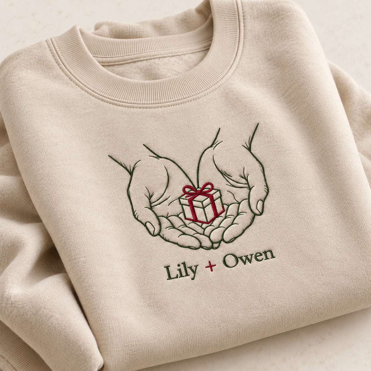 Gift From My Hands personalized Christmas hands design; Sand sweatshirt mockup, personalization detail; sample text Lily + Owen