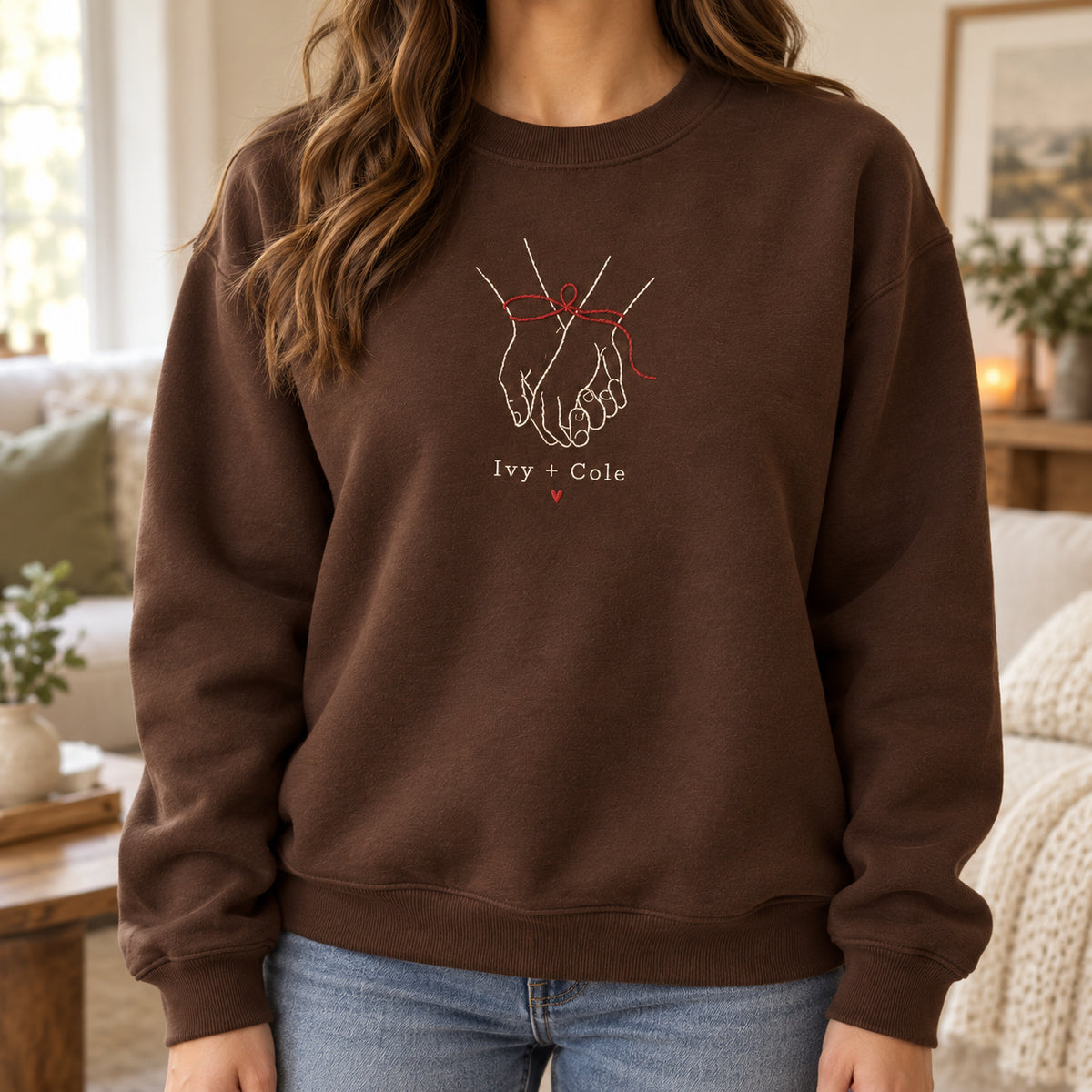 Ribbon Around Us personalized Christmas hands design; Chocolate sweatshirt mockup, lifestyle; sample text Ivy + Cole
