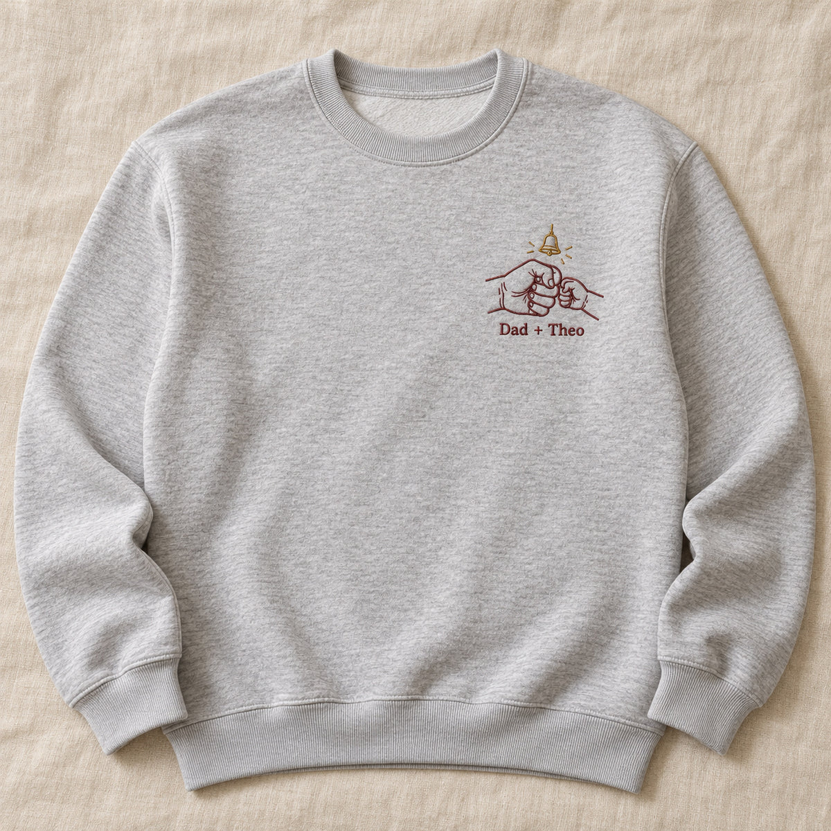 Tiny Bell Promise personalized Christmas hands design; Ash sweatshirt mockup, hero; sample text Dad + Theo
