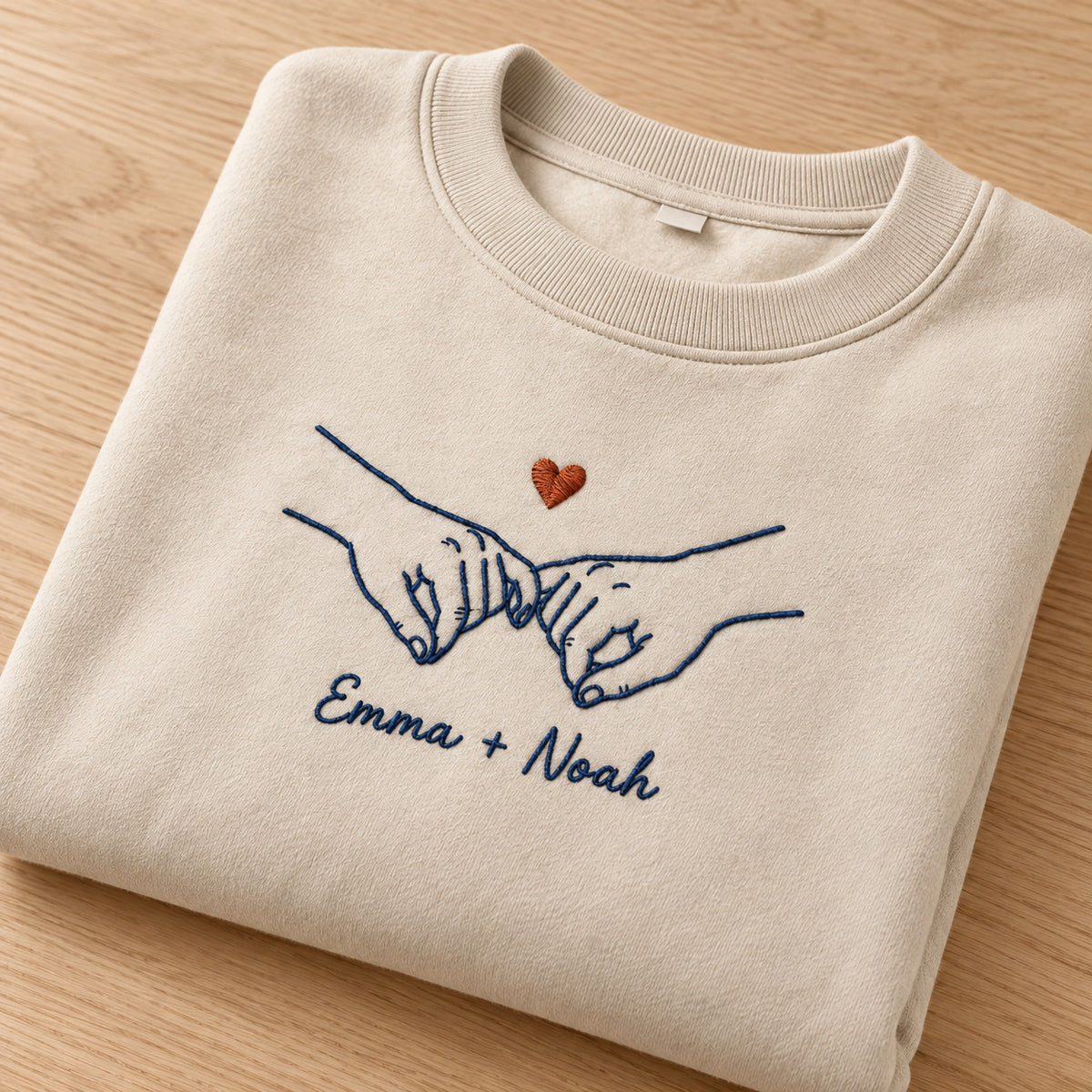 Pinky Promise personalized Couples hands design; Sand sweatshirt mockup, personalization detail; sample text Emma + Noah
