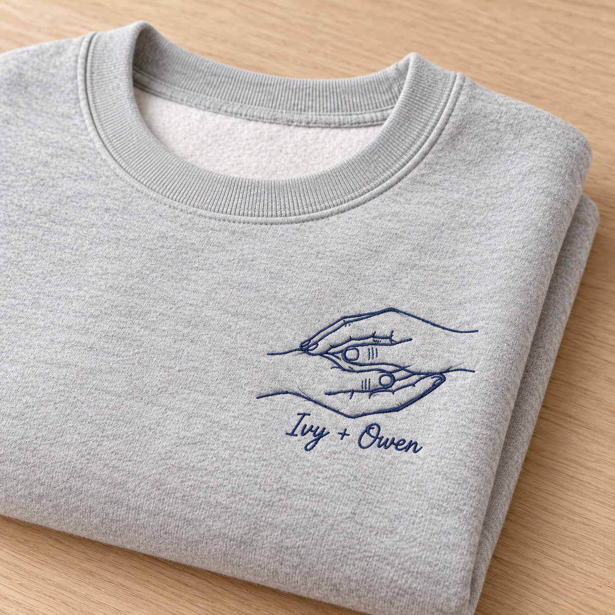 Palm Kiss personalized Couples hands design; Ash sweatshirt mockup, personalization detail; sample text Ivy + Owen