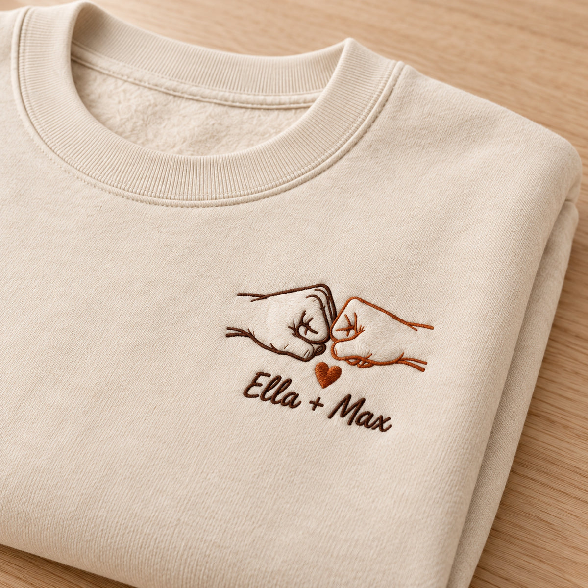 Little Squeeze personalized Couples hands design; Beige sweatshirt mockup, personalization detail; sample text Ella + Max