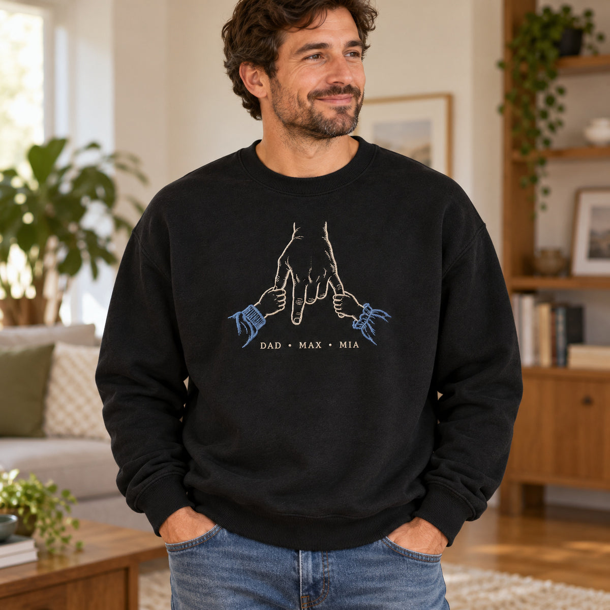 Two Little Anchors personalized Dad hands design; Black sweatshirt mockup, lifestyle; sample text DAD • MAX • MIA