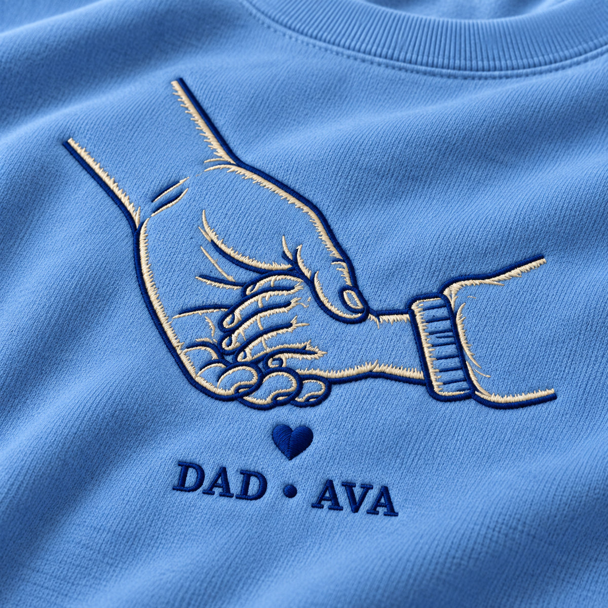 Walking Together personalized Dad hands design; Carolina Blue sweatshirt mockup, embroidery detail; sample text DAD • AVA