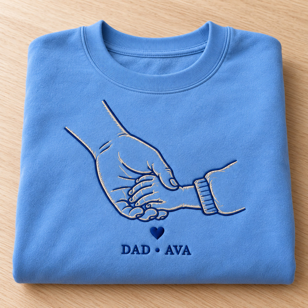 Walking Together personalized Dad hands design; Carolina Blue sweatshirt mockup, personalization detail; sample text DAD • AVA