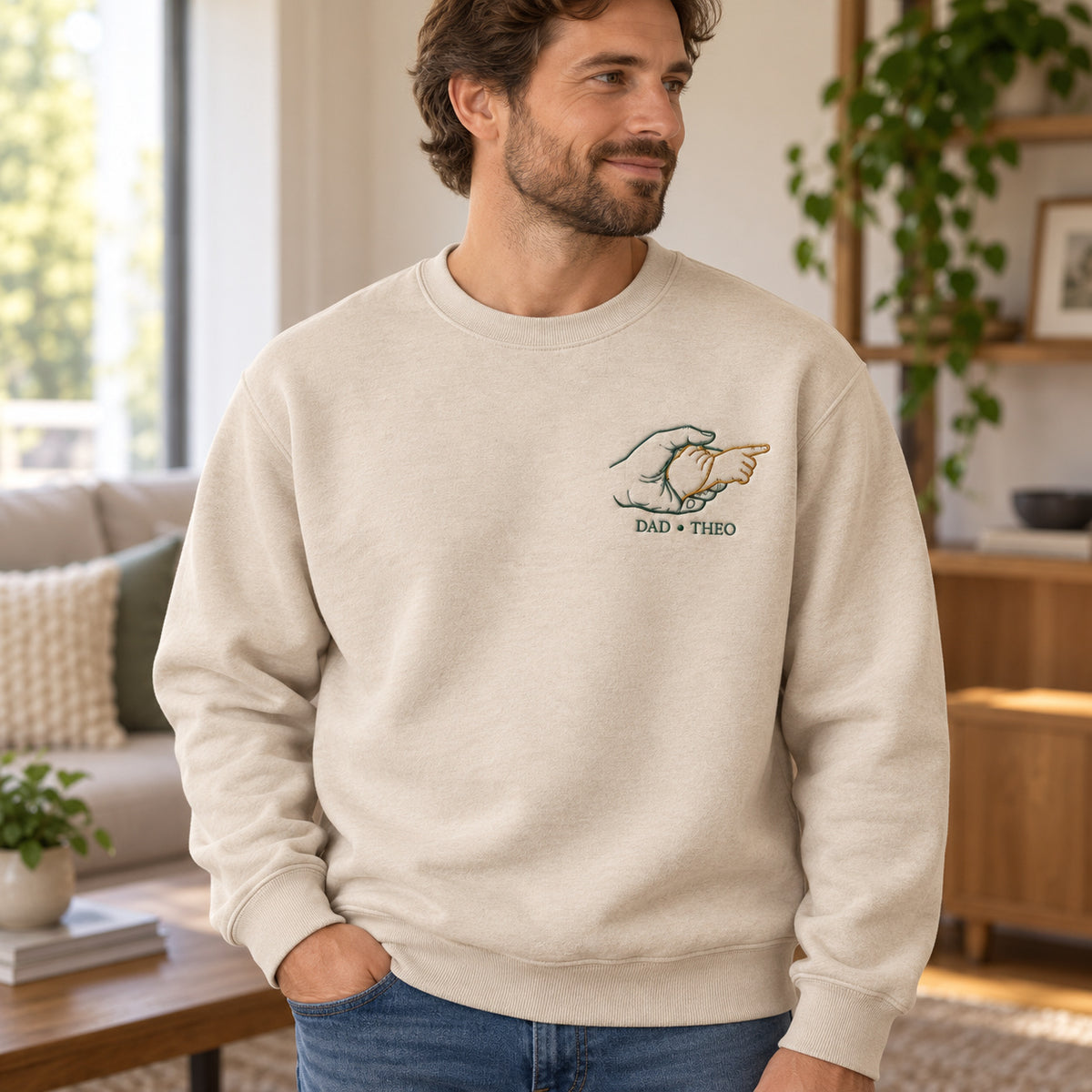 Guiding The Way personalized Dad hands design; Beige sweatshirt mockup, lifestyle; sample text DAD • THEO
