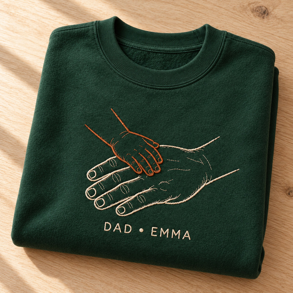 Hand Stack Team personalized Dad hands design; Forest Green sweatshirt mockup, personalization detail; sample text DAD • EMMA