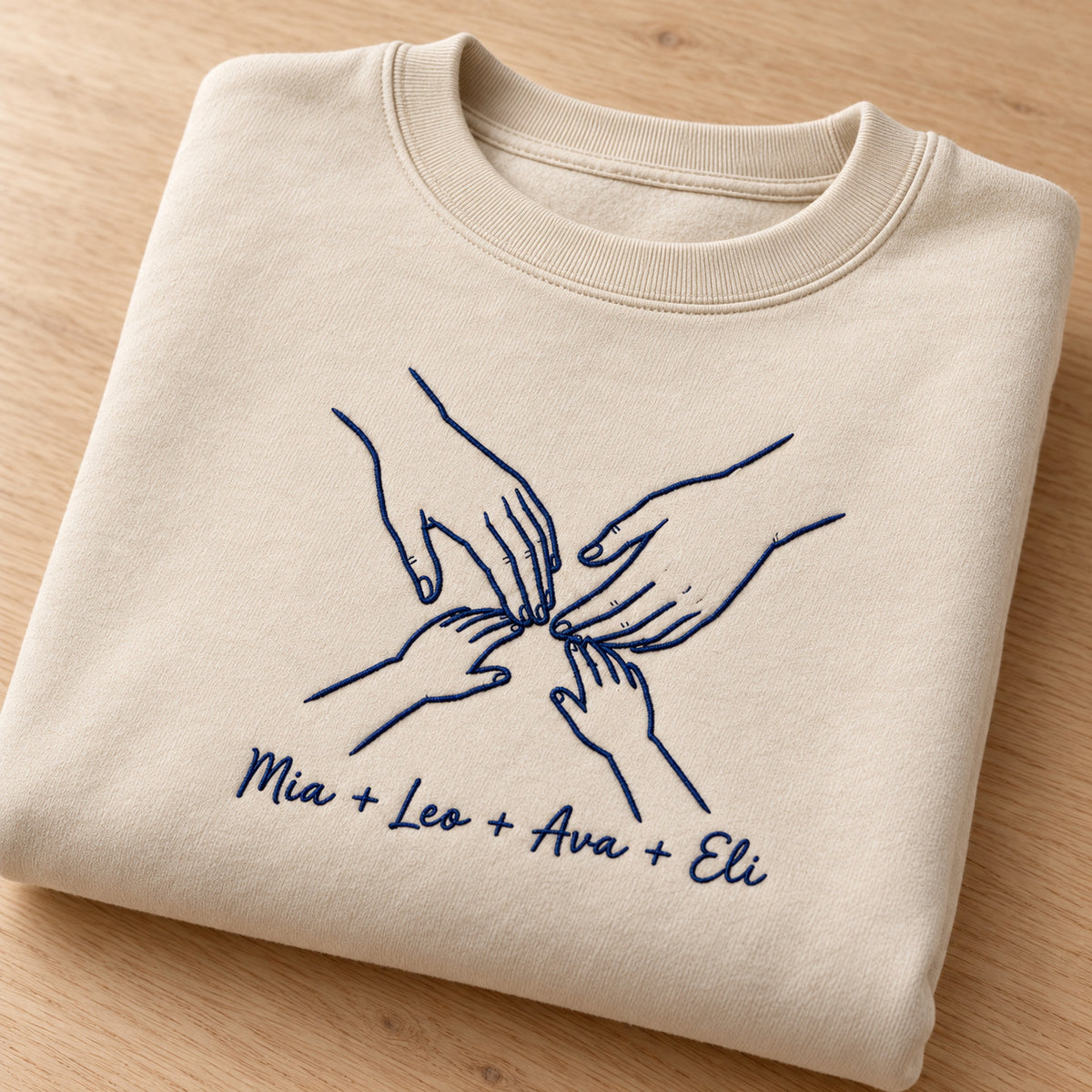 Family Circle personalized Family hands design; Sand sweatshirt mockup, personalization detail; sample text Mia + Leo + Ava + Eli