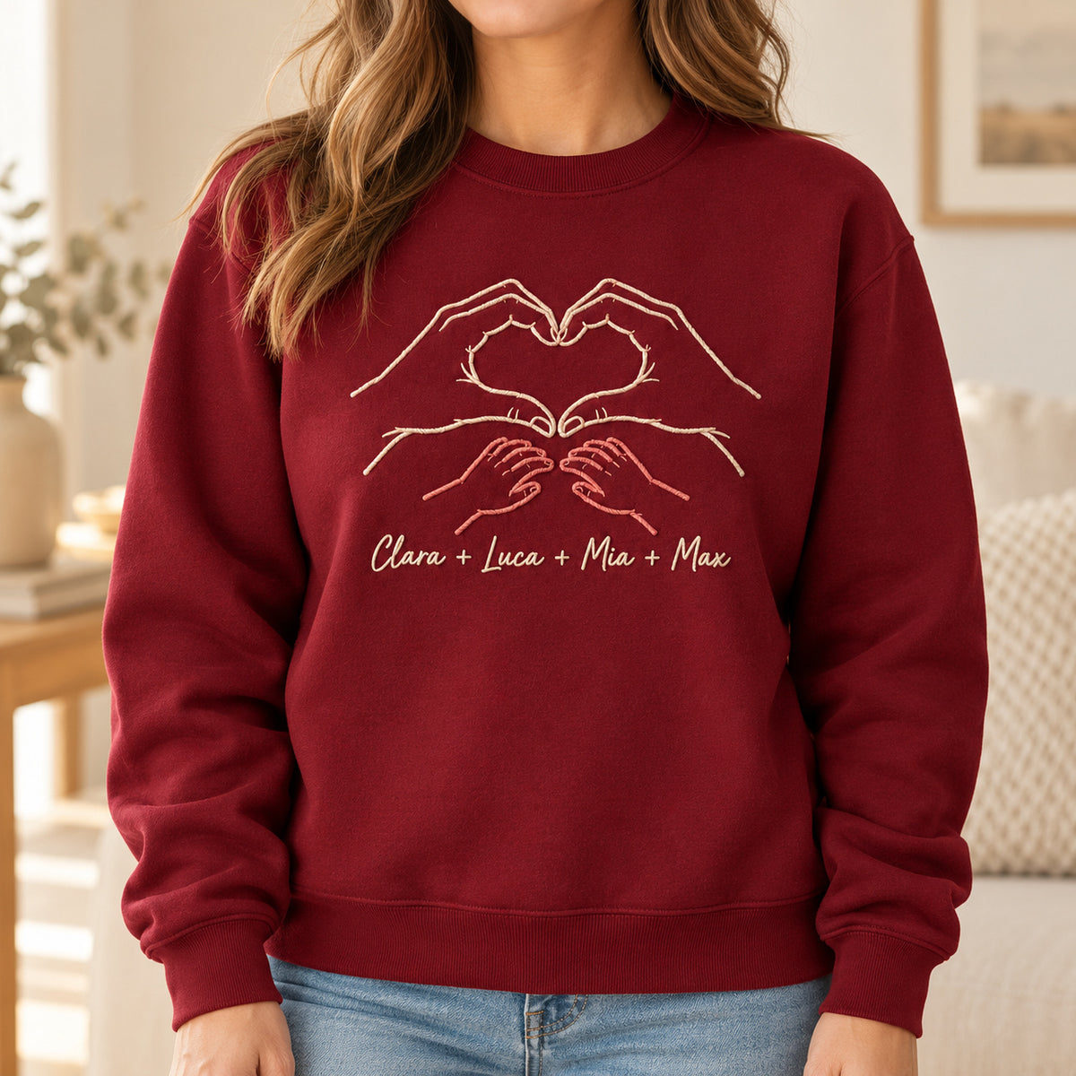 Four of Us personalized Family hands design; Maroon sweatshirt mockup, lifestyle; sample text Clara + Luca + Mia + Max