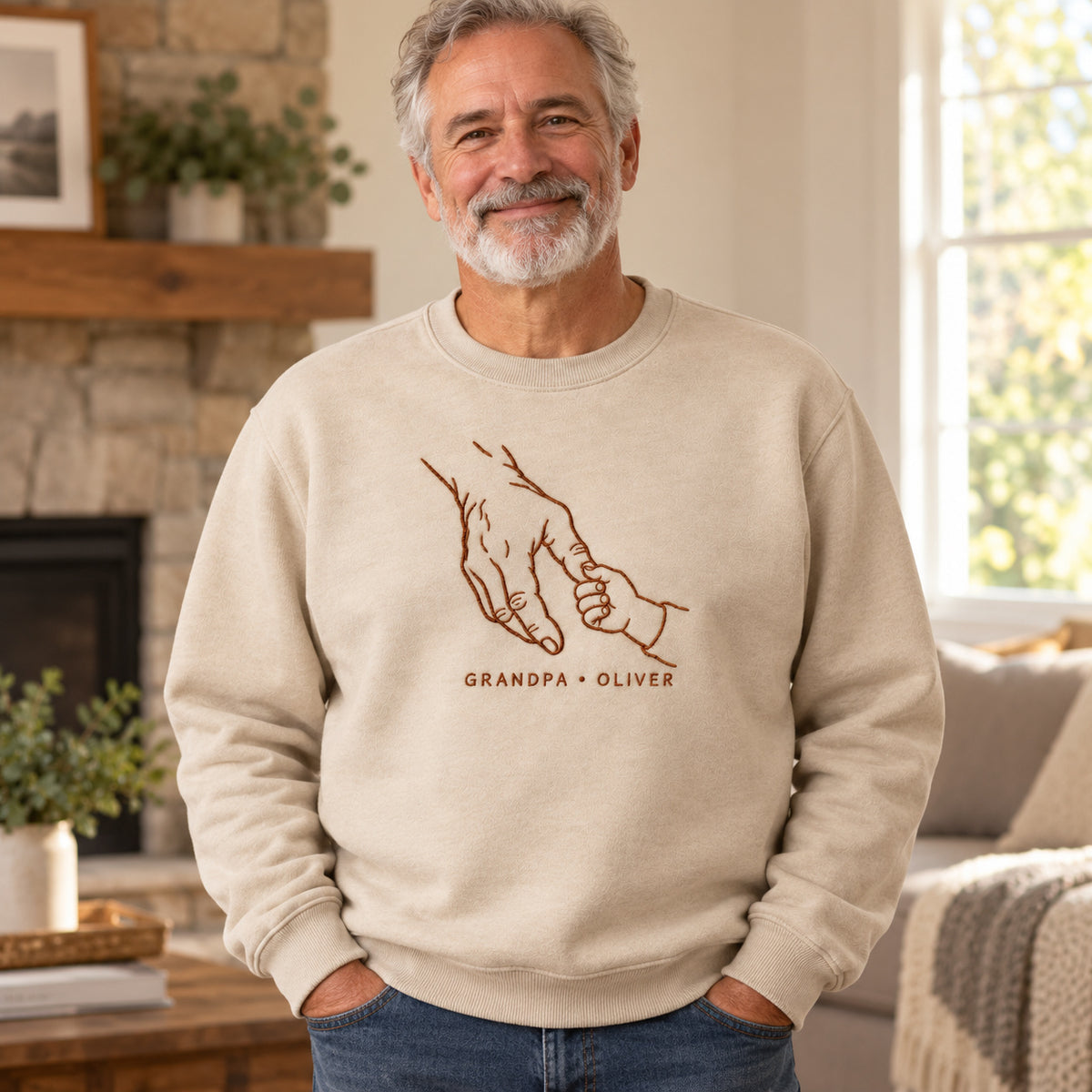 Generations Grip personalized Grandpa hands design; Sand sweatshirt mockup, lifestyle; sample text GRANDPA • OLIVER