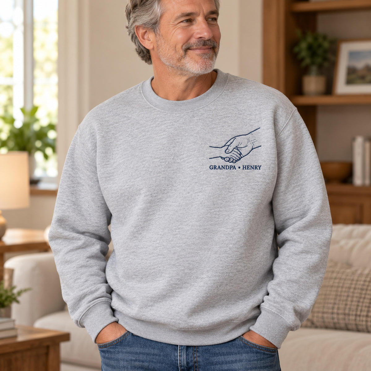 Grandpa Handshake personalized Grandpa hands design; Ash sweatshirt mockup, lifestyle; sample text GRANDPA • HENRY