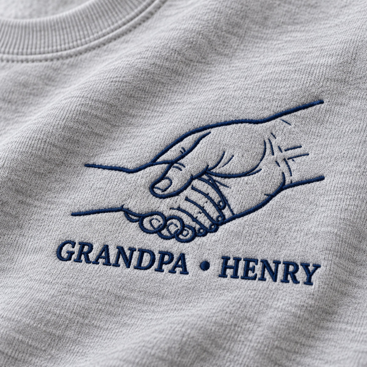 Grandpa Handshake personalized Grandpa hands design; Ash sweatshirt mockup, embroidery detail; sample text GRANDPA • HENRY