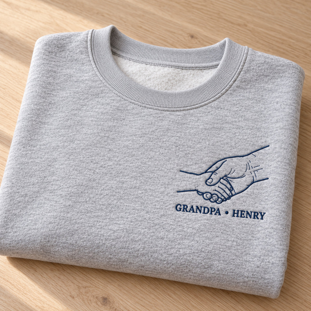 Grandpa Handshake personalized Grandpa hands design; Ash sweatshirt mockup, personalization detail; sample text GRANDPA • HENRY