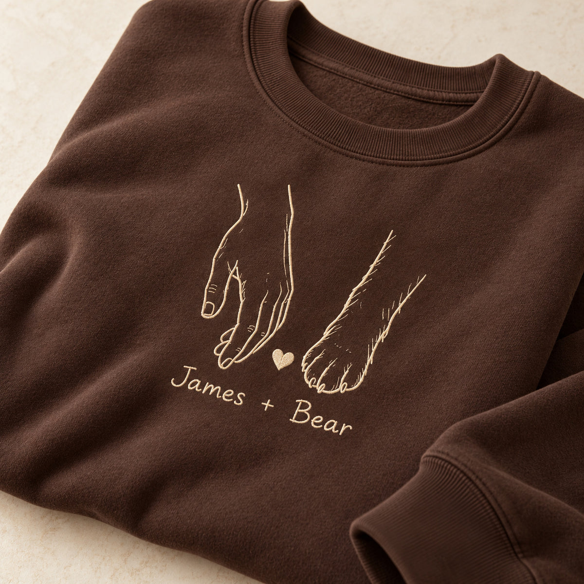 Side By Side personalized Pet_Lover hands design; Chocolate sweatshirt mockup, personalization detail; sample text James + Bear