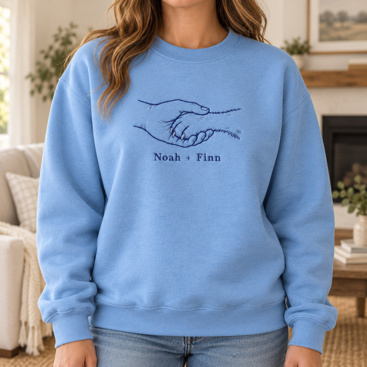 Gentle Paw Hold personalized Pet_Lover hands design; Carolina Blue sweatshirt mockup, lifestyle; sample text Noah + Finn