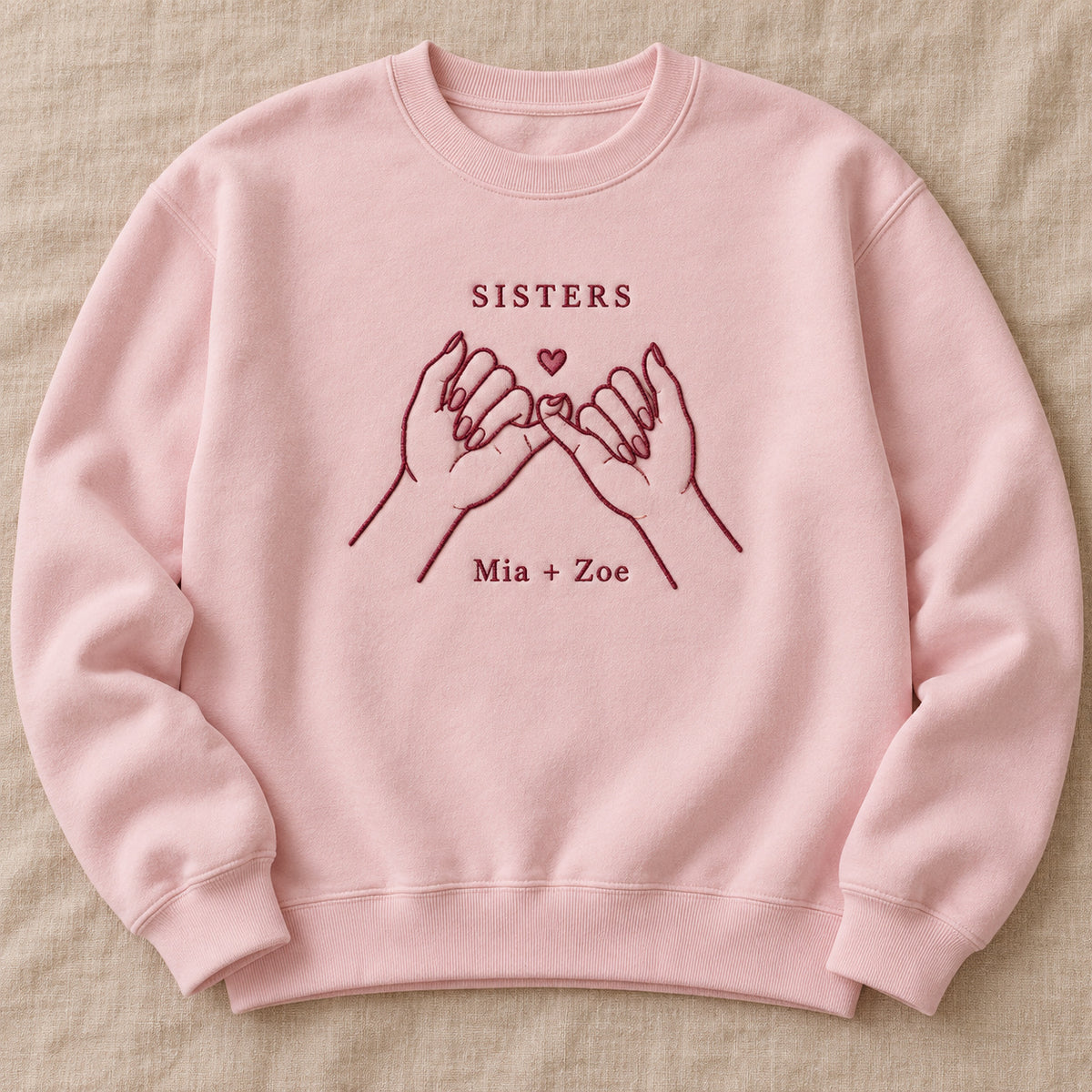 Sister Promise personalized Sister hands design; Light Pink sweatshirt mockup, hero; sample text SISTERS / Mia + Zoe