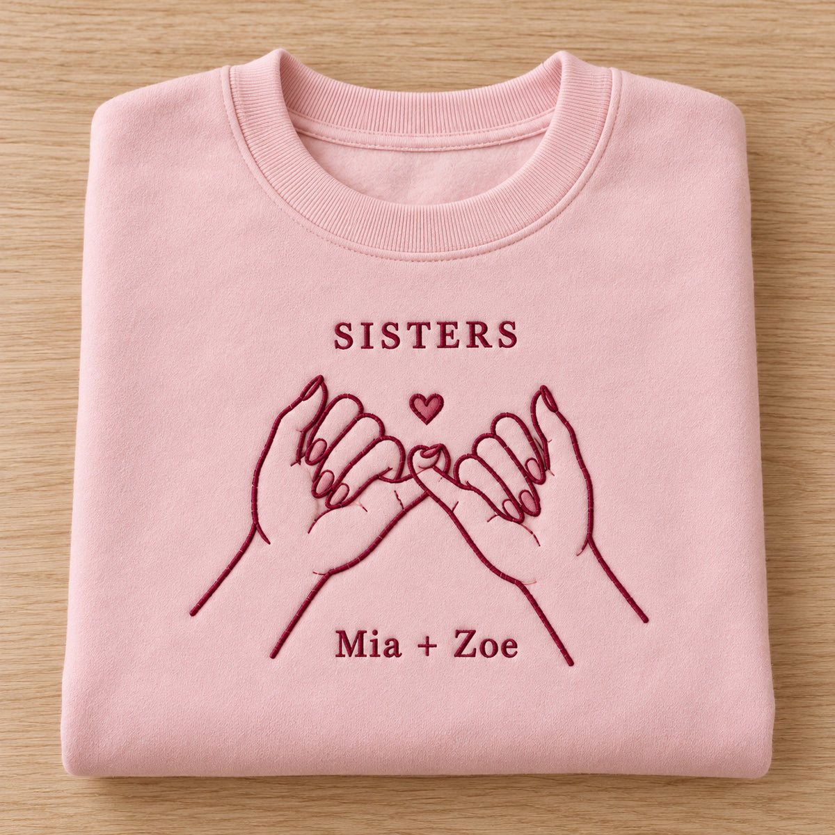 Sister Promise personalized Sister hands design; Light Pink sweatshirt mockup, personalization detail; sample text SISTERS / Mia + Zoe