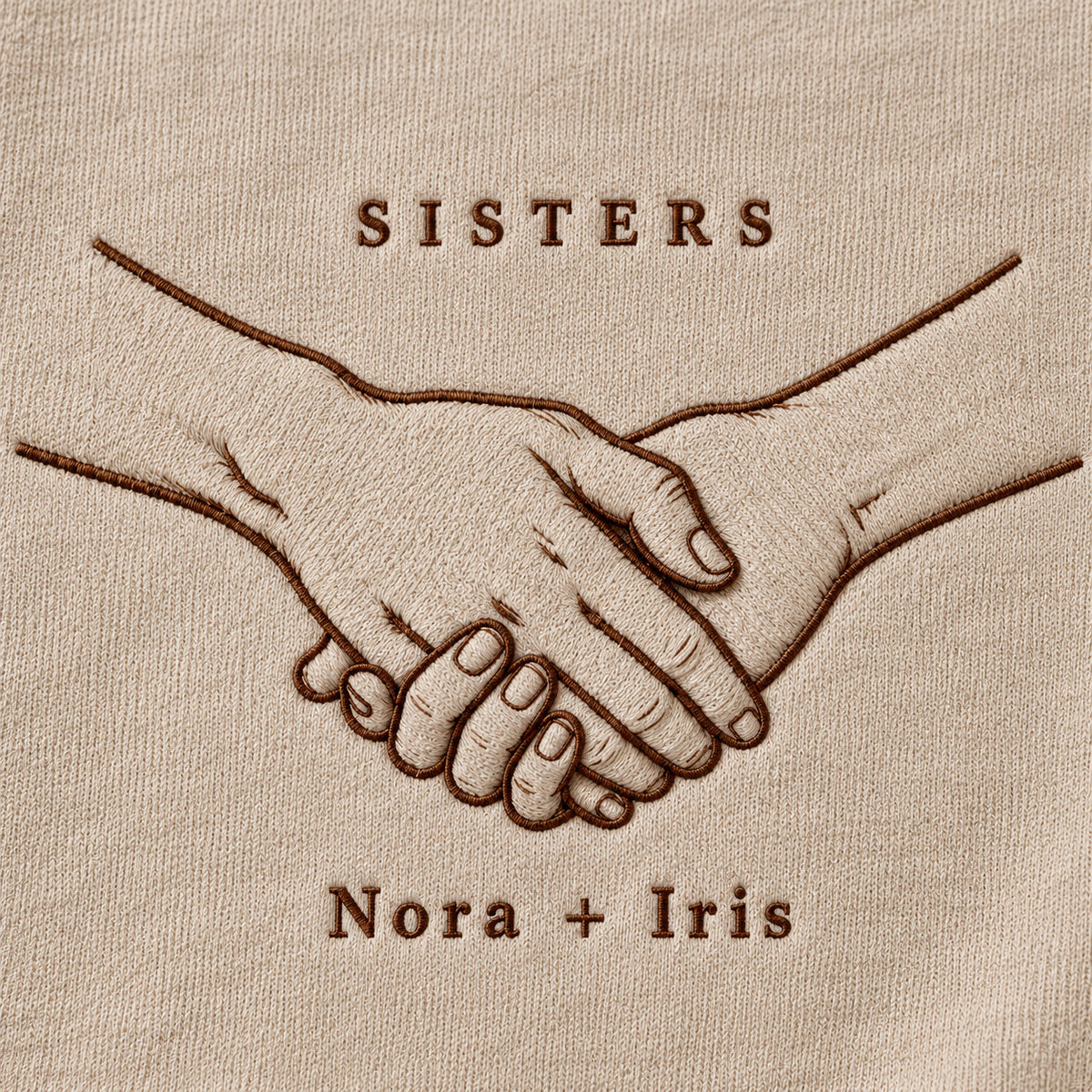 Hands Together personalized Sister hands design; Sand sweatshirt mockup, embroidery detail; sample text SISTERS / Nora + Iris
