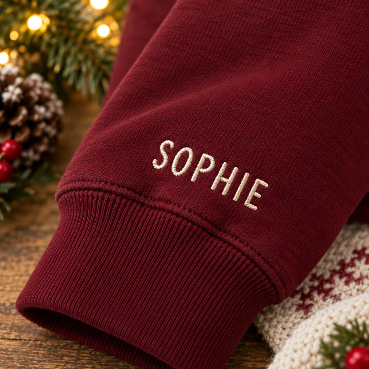 Warm Wishes Mittens sweatshirt concept mockup featuring two mittens connected by a heart-shaped cord, sample personalization SOPHIE, personalization view