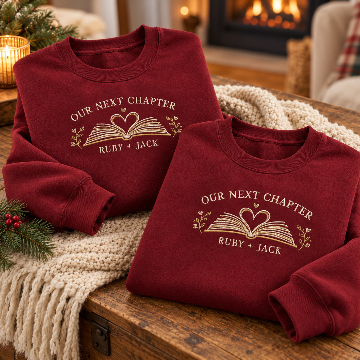 Our Next Chapter sweatshirt concept mockup featuring an open book with a heart and leafy accents, sample personalization RUBY + JACK, personalization view