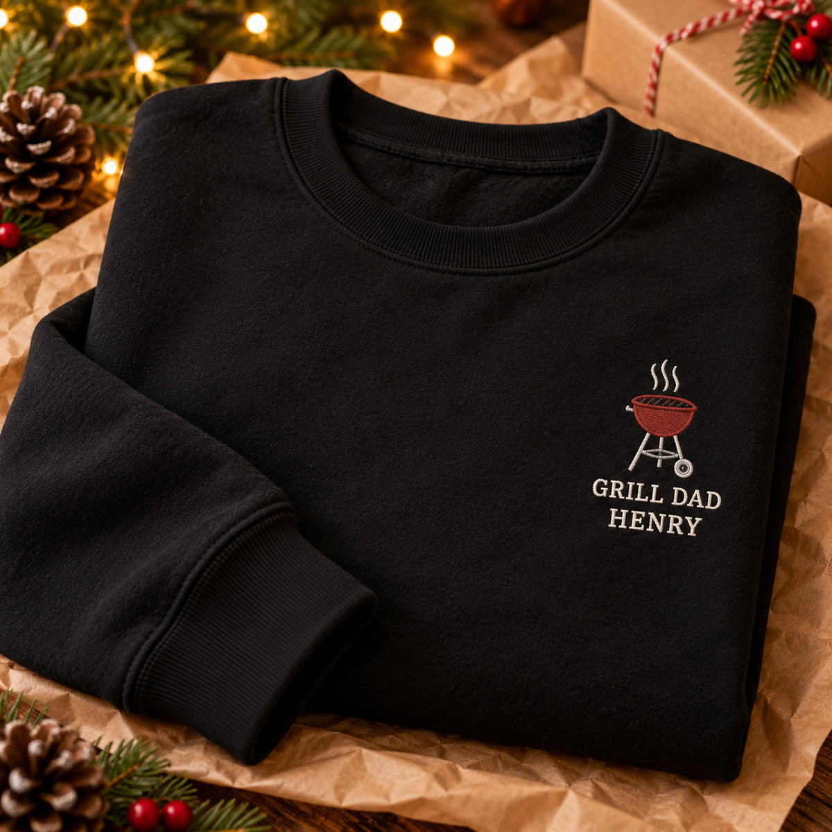 Grill Dad sweatshirt concept mockup featuring a small round barbecue grill with rising steam, sample personalization HENRY, personalization view