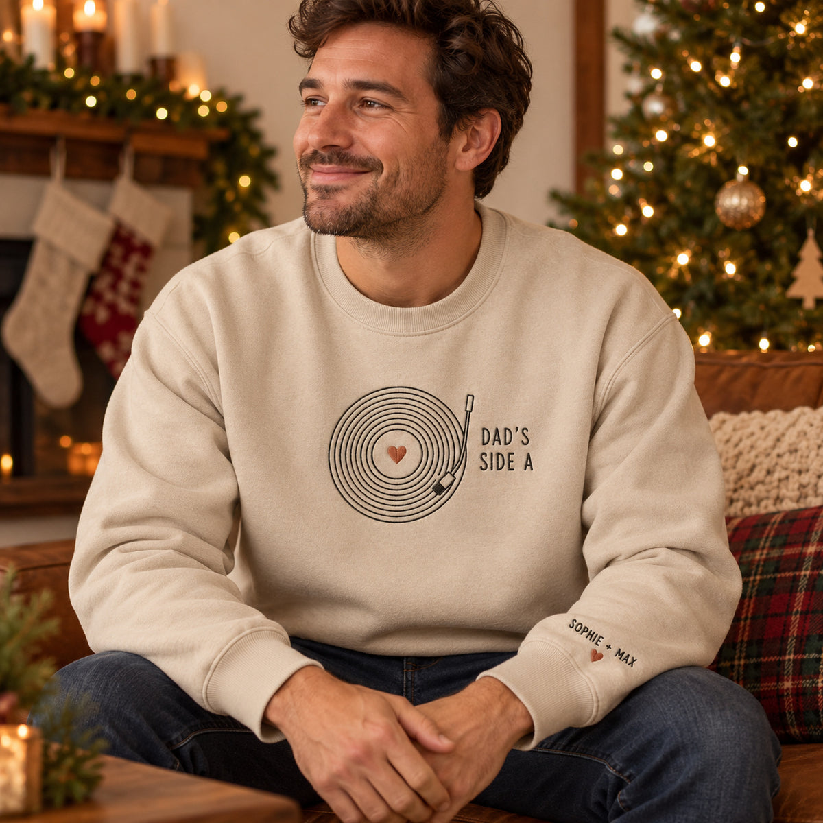 Dad's Vinyl Record sweatshirt concept mockup featuring a vinyl record with a heart center and turntable arm, sample personalization SOPHIE + MAX, lifestyle view